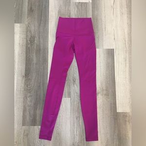 Fuchsia full length lululemon wunder under leggings.